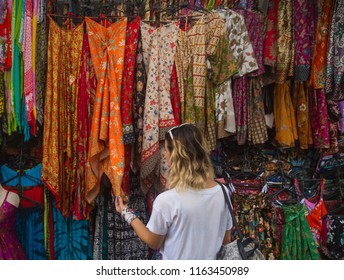 Shopping In Bali. Handmade Craft Souvenirs, Clothes And Bags. Shopping, Fashion And People Concept