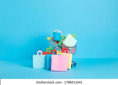 Shopping Basket Full Of Paper Bags. Sesonal Sale, Online Deals, Discounts, Promotion, Shopping Addiction Concept