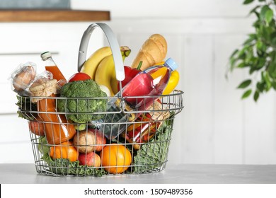Shopping basket with grocery products on grey table indoors. Space for text - Shutterstock ID 1509489356