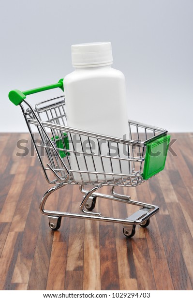 shopping cart with a box of\
medicines