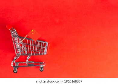 Shopping Cart And China Flag On Red Background. Shopping Online Or ECommerce, Delivery Service Store