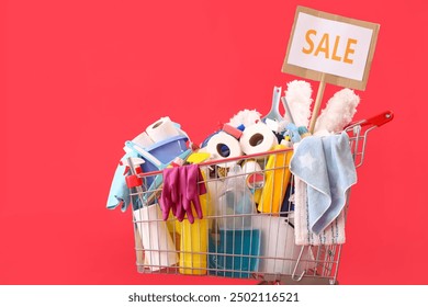 Shopping cart full of cleaning supplies with word SALE on red background - Powered by Shutterstock