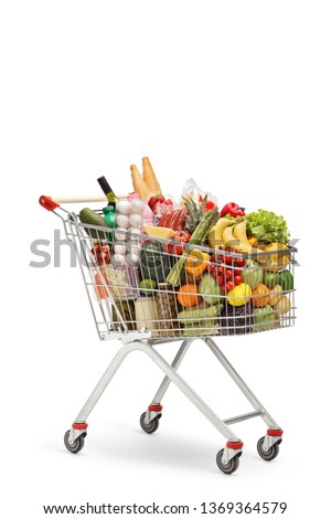 Shopping cart full of food products isolated on white background