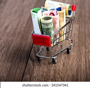 Shopping Cart Full Of Money (dollar, Euro). Multi Currency Basket Concept