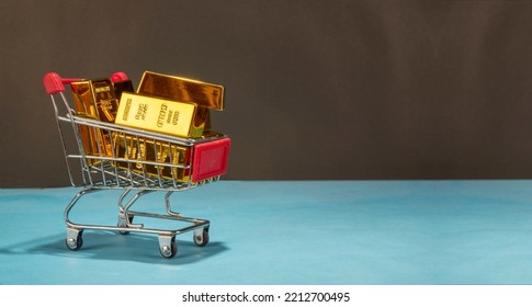 Shopping Cart Full Of Pure Shiny Gold Bar Or Ingot On Clean Banner Template