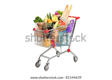 A shopping cart full with various groceries isolated on white background
