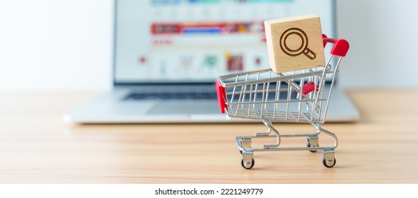 Shopping cart with Magnifying icon block and laptop computer with marketplace website, technology, ecommerce, SEO, Search Engine Optimization, Advertising, keyword and online payment concept - Shutterstock ID 2221249779