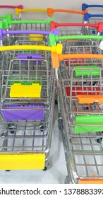 Shopping cart are minimize for model,show,keep miscellaneous items.They are on shelf,make to iron and colorful plastic to handdle.