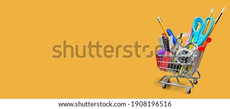 Shopping cart model with school supply stationary. Back to school and education