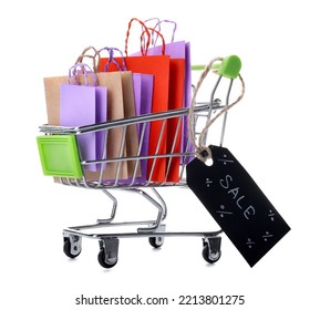 Shopping cart with paper bags and black tag with word SALE on white background - Powered by Shutterstock