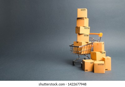 Shopping cart supermarket with boxes. Sales of products. The concept commerce, online shopping. Purchasing power, delivery order. E-commerce, sales and sale of goods through online trading platforms. - Shutterstock ID 1422677948