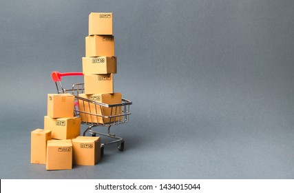 Shopping cart supermarket with boxes. Sales of products. The concept commerce, online shopping. E-commerce, sales and sale of goods through online trading platforms. Purchasing power, delivery order. - Shutterstock ID 1434015044