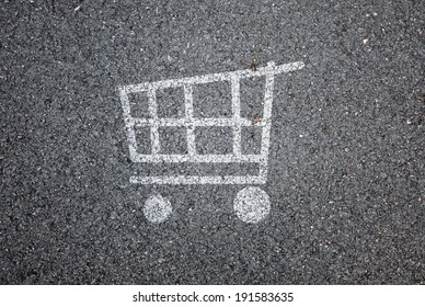 Shopping cart symbol on road background