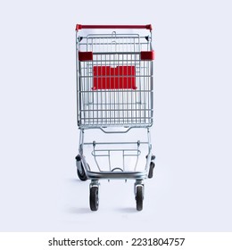 shopping cart trolley red colour on white background | E-commerce supermarket trolley front view