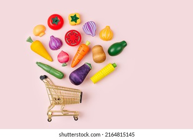 Shopping Cart With Wooden Vegetables. Game For Learning And Development Of The Child. Cute Kids Toys To Play In The Kitchen. Healthy Food Concept