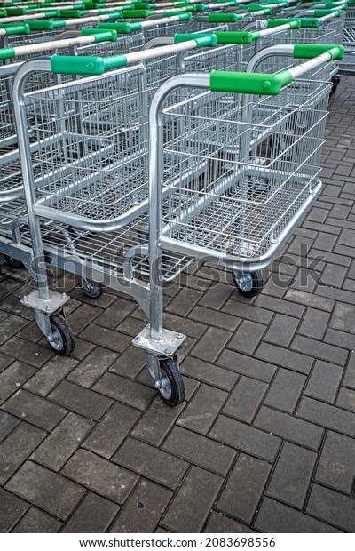 Shopping\
carts at the entrance to the store\
close-up