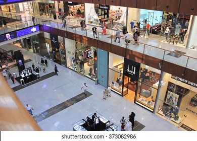 Shopping Center Dubai Mall, Top View Inside, Boutiques And People Make Purchases, United Arab Emirates April 14, 2014, Soft Focus