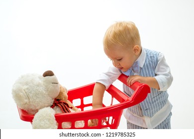 Shopping For Children. Little Boy Go Shopping With Full Cart. Savings On Purchases. Happy Childhood And Care. Little Boy Child In Toy Shop. It Is Bargain. Pleased With Choice. How About Price.