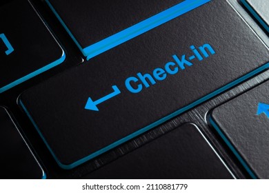 Shopping concept, Close-up laptop keyboard with blue light button CHECK-IN.