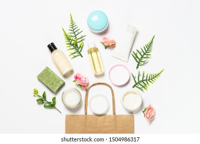 Shopping concept. Natural osmetics, Skin care product and shopping bag. Flat lay image on white. - Shutterstock ID 1504986317