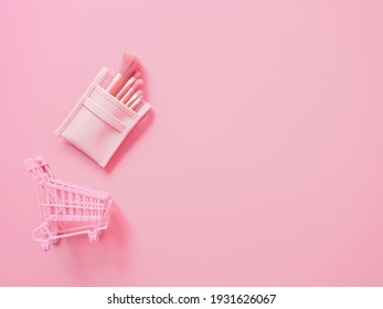 shopping cosmetic concept from blush brush set and trolley on pink background. - Shutterstock ID 1931626067