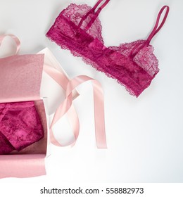 Shopping and fashion, female wardrobe concept. Set of glamorous stylish sexy lace lingerie in pink giftbox on white background. Woman accessories.