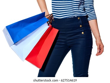 Shopping. The French Way. Closeup On Stylish Woman With Shopping Bags Of The Colours Of The French Flag Isolated On White Background