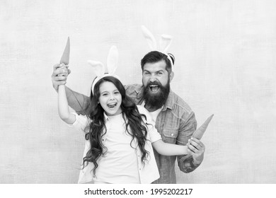 Shopping Grocery. Funny Team. Spring Holiday. Celebrate Easter. Easter Food. Girl And Dad Bunny Ears. Happy Family Wear Bunny Ears. Easter Fun And Happiness. Father And Daughter Play With Carrots