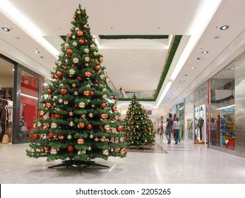 Shopping mall interior decorated with christmas trees
