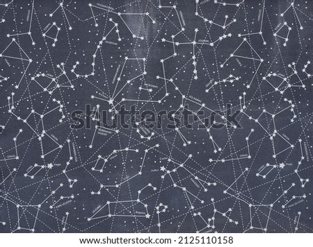 Shopping mall wall in europe with symbolic map of starry sky: vertical panel, street wall decoration, stone wall with drawings.
