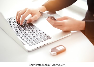 Shopping Online And Car Payment By Using Laptop With Sun Light Effect