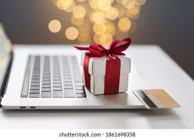 Shopping online during holidays. Ordering Christmas gifts. Using laptop computer and credit card. Shopping, internet banking, store online, payment, sale, spending money, e-commerce, holiday concept - Powered by Shutterstock