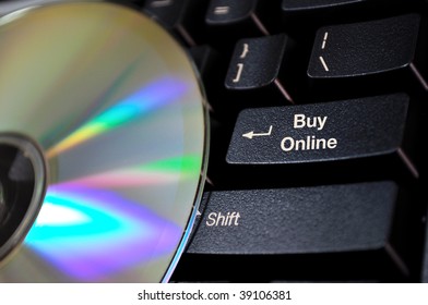 Shopping on-line music with Compact Disk digital audio on the computer keyboard with text Buy Online on the enter key. Great file for your web banner or flyer.