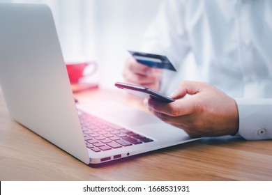 shopping online payment by using smart phone.hands holding credit card and using smart phone. online shopping concept.