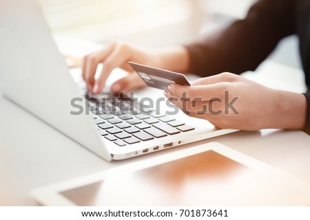 shopping and online payment by using notebook with sun light effect