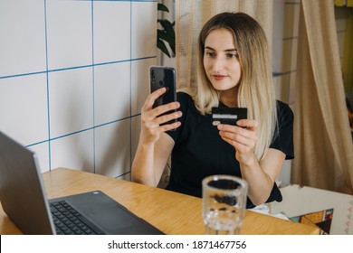 Shopping online, Savvy Shoppers, Installment Payments. Woman at home using credit card and laptop for online payment. Internet shopping concept