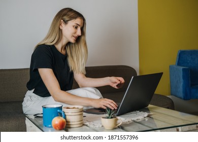 Shopping online, Savvy Shoppers, Installment Payments. Woman at home using credit card and laptop for online payment. Internet shopping concept - Shutterstock ID 1871557396