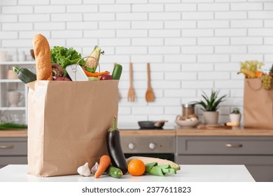 Shopping paper bag with fresh products on table in kitchen - Powered by Shutterstock