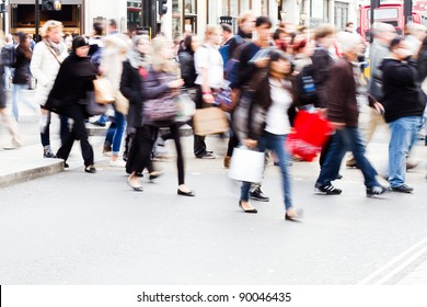 Shopping People Crossing A Street In London