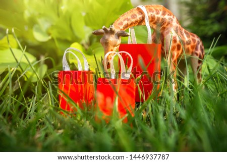 Shopping, sale discounts, jungle beasts rush to shopping, black friday with paper bags  green background with copy space for text 
