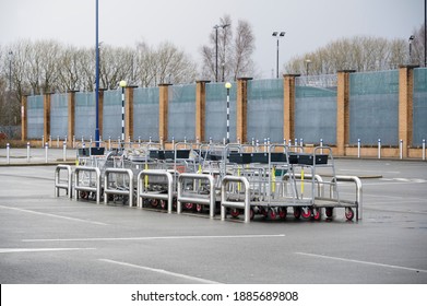 Shopping Trolley Group At Closed Shop Car Park Empty Due To Covid-19