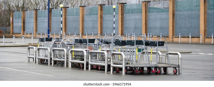 Shopping Trolley Group At Closed Shop Car Park Empty Due To Covid-19