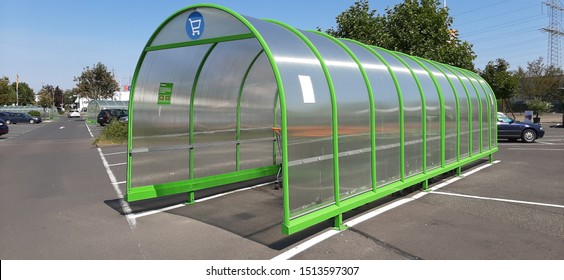 Shopping Trolley Group In Shelter At Supermarket Shop Car Park