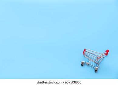 shopping trolley on blue background,Copy space,minimal style