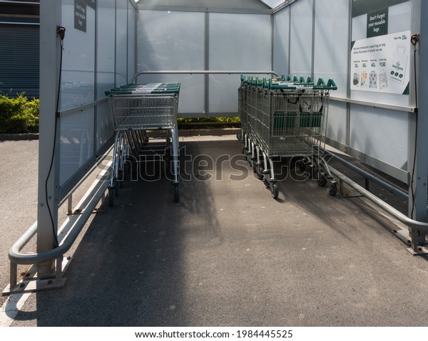 Shopping Trolleys neatly put away in a designated\
car park shelter.\
Morrisons supermarket:\
Guisborough, England -\
June 2nd 2021