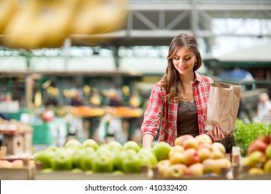 Shopping Woman Buying Fruit At The Market
