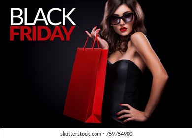 Shopping Woman Holding Red Bag On Dark Background In Black Friday Holiday