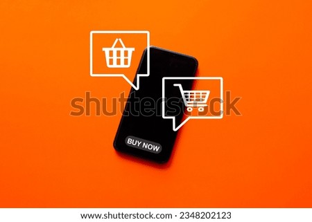 Shopping,Online Shopping,ecommmerce,Home delivery,Online store concept.,Shopping cart and basket icon in speech bubble on smartphone over orange background use for technology,business idea.