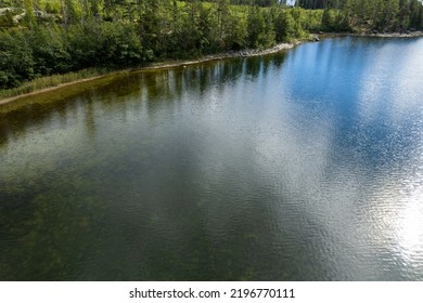 The Shore Of A Forest Lake. Aerial Top View.