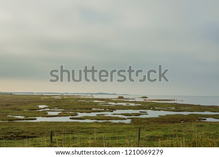 Similar – Lahnungen coastline barge